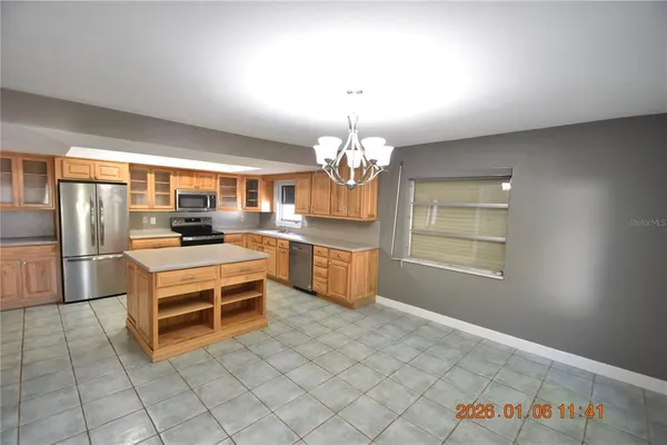 a kitchen with stainless steel appliances cabinets and a kitchen counter top