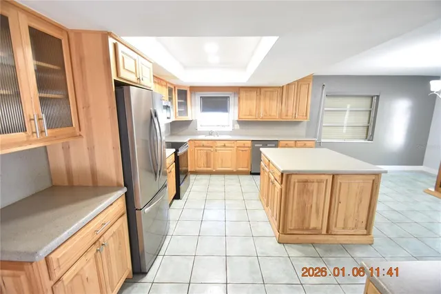 a kitchen with a refrigerator stove and sink