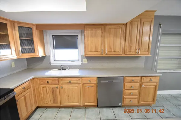 a view of a kitchen with furniture and staircase