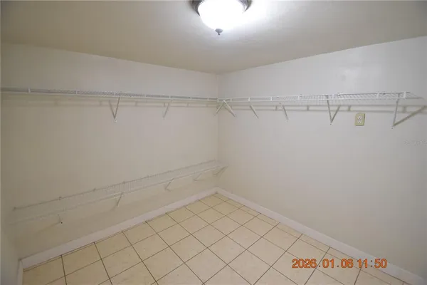 a bathroom with a granite countertop toilet sink and mirror