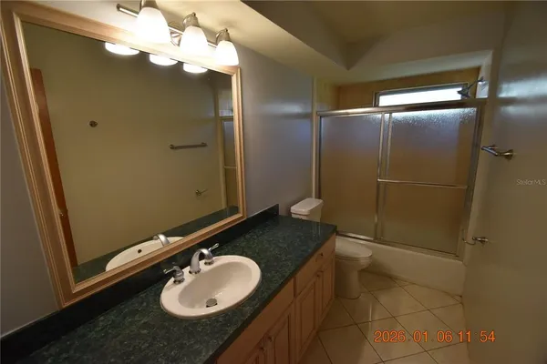 a view of a livingroom with furniture and windows