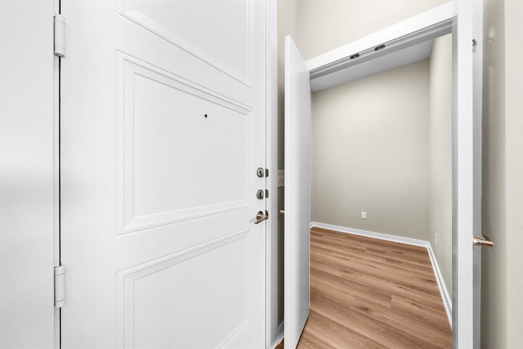 3522 Main Street, Unit 303 Rowlett, TX 75088 - Photo 6 of 23 Entryway with wood finished floors and baseboards