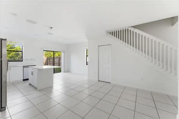 a view of kitchen with furniture and window