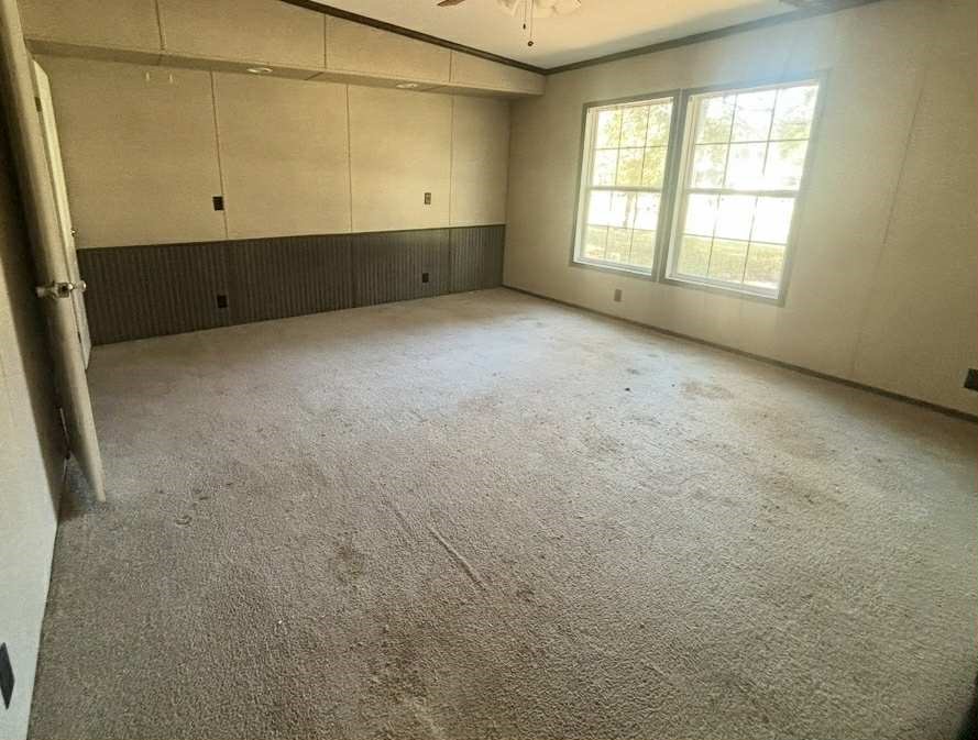 39 County Road 2801 Cleveland, TX 77327 - Photo 9 of 10 an empty room with cabinet