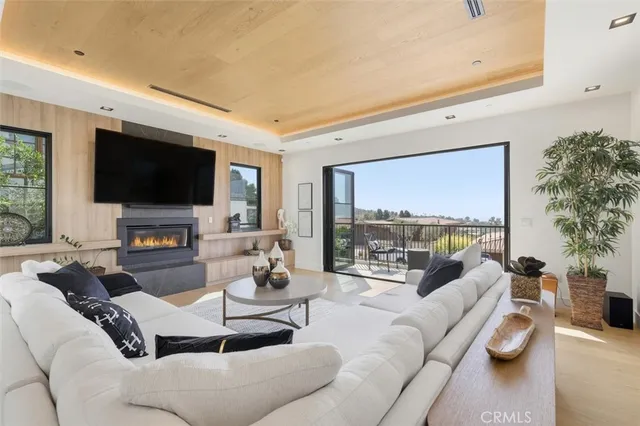 a view of a balcony with chairs and wooden floor