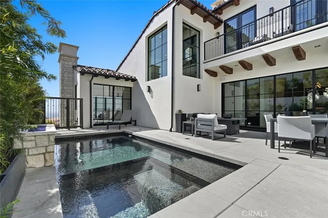 a view of a swimming pool with patio