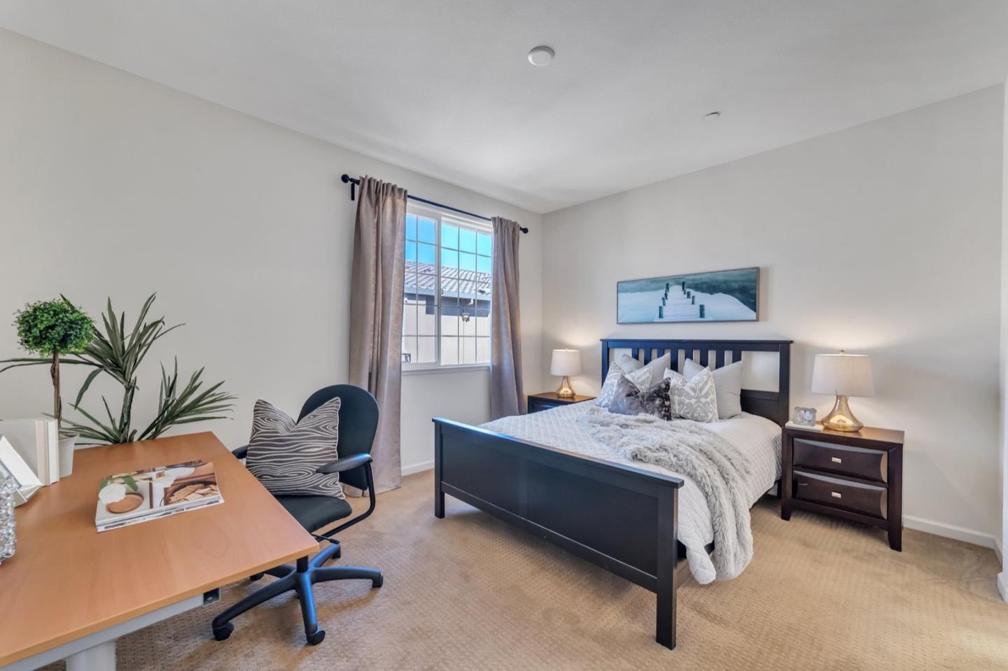 576 Almaden Walk Loop San Jose, CA 95125 - Photo 13 of 34 a bedroom with a bed and a desk