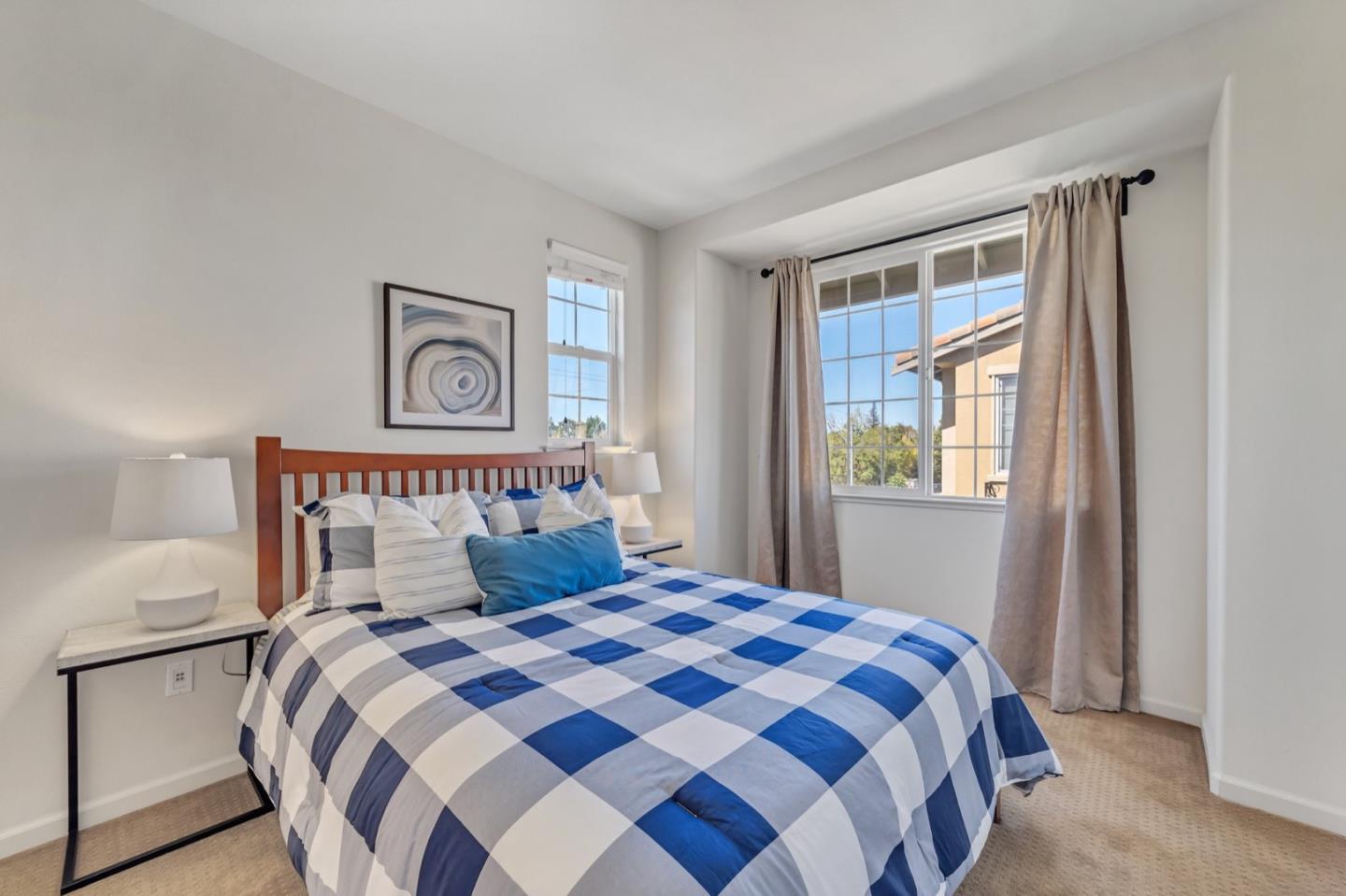 576 Almaden Walk Loop San Jose, CA 95125 - Photo 19 of 34 a bedroom with a large bed and a window