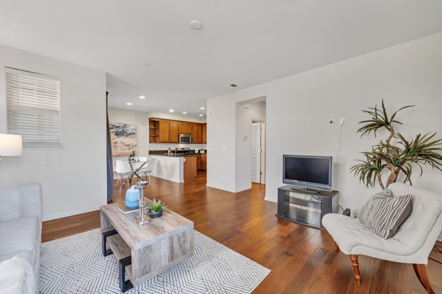 576 Almaden Walk Loop San Jose, CA 95125 - Photo 3 of 34 a living room with furniture and a flat screen tv