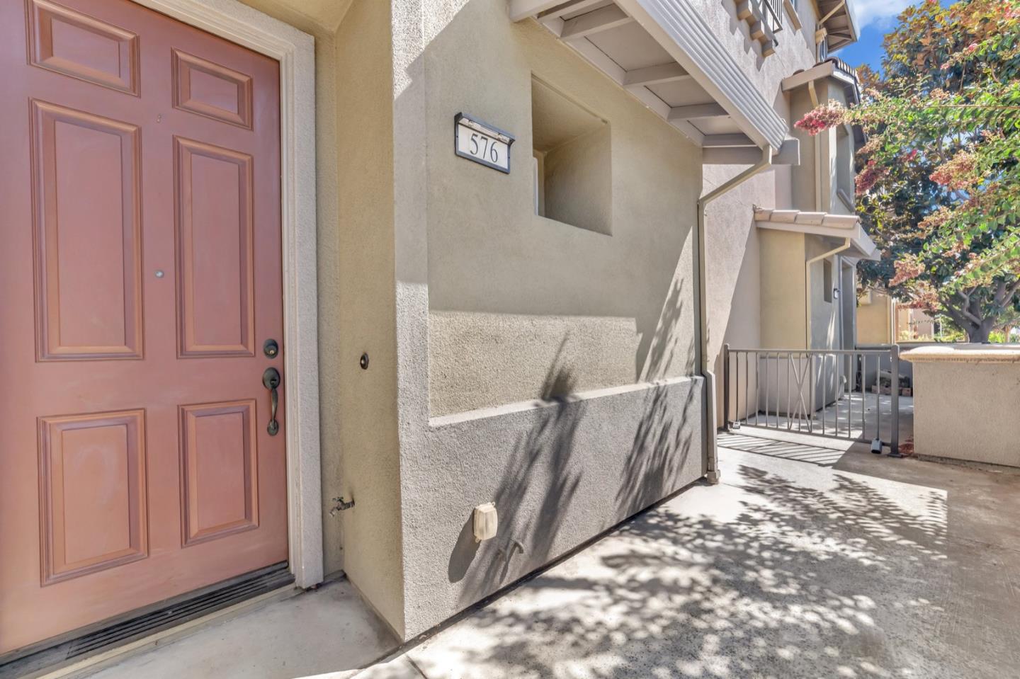 576 Almaden Walk Loop San Jose, CA 95125 - Photo 23 of 34 a view of a house with a small yard and wooden fence