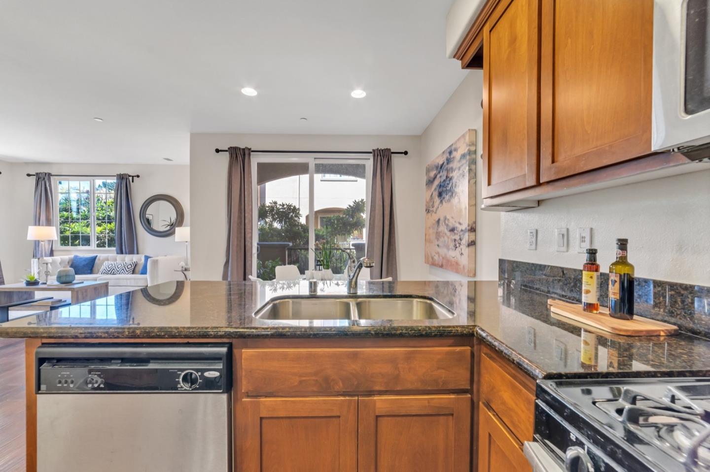 576 Almaden Walk Loop San Jose, CA 95125 - Photo 8 of 34 a kitchen with a sink stove and cabinets
