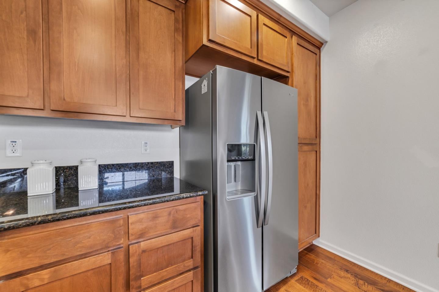 576 Almaden Walk Loop San Jose, CA 95125 - Photo 9 of 34 a kitchen with stainless steel appliances granite countertop a refrigerator and a cabinets