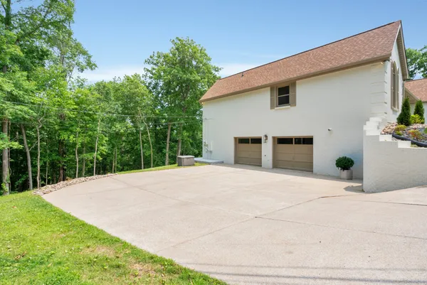 a view of a chairs and table in the balcony