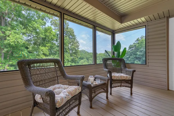 a kitchen with stainless steel appliances granite countertop a sink a stove and a wooden floors