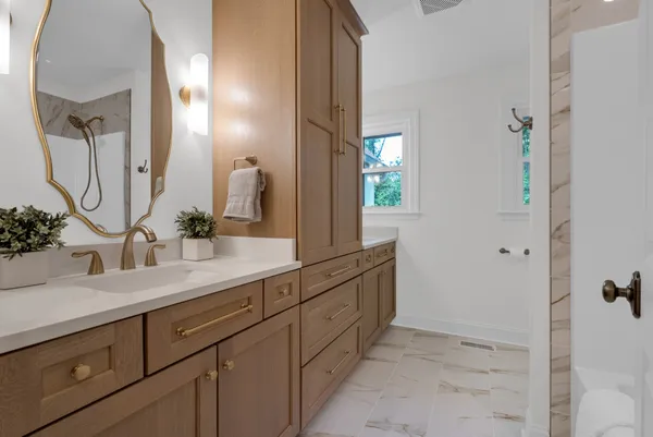 a bathroom that has a glass shower door