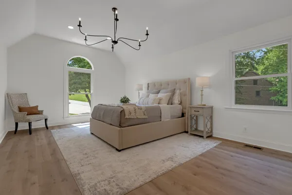 a view of a kitchen with a sink and dishwasher cabinet with wooden floor