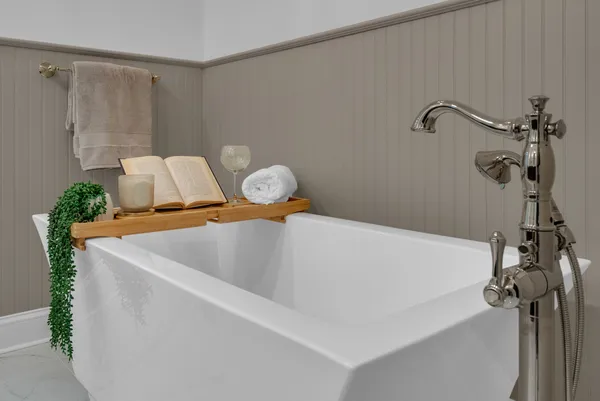 a bathroom with a granite countertop sink mirror and toilet