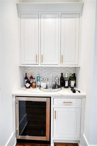 a bedroom with a bed and a lamp next to a window