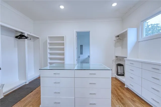a bathroom with a double vanity sink toilet and shower