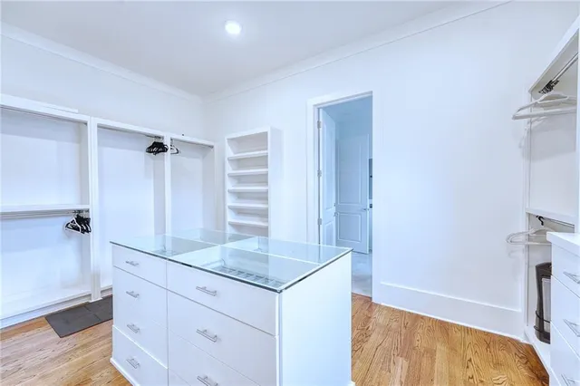 a bathroom with a granite countertop sink and shower
