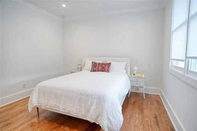 a bathroom with a sink a toilet a mirror a bathtub and shower