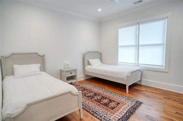 a bedroom with a bed and a chair