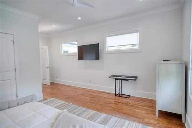 a view of a kitchen area with furniture and wooden floor