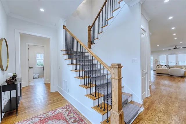 a view of entryway and hall with wooden floor