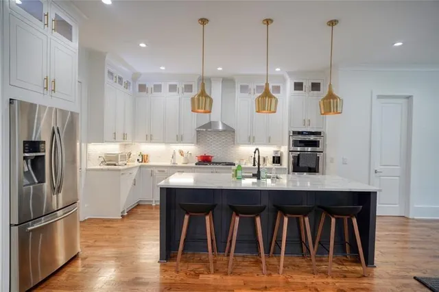 a living room with kitchen island furniture and a wooden floor