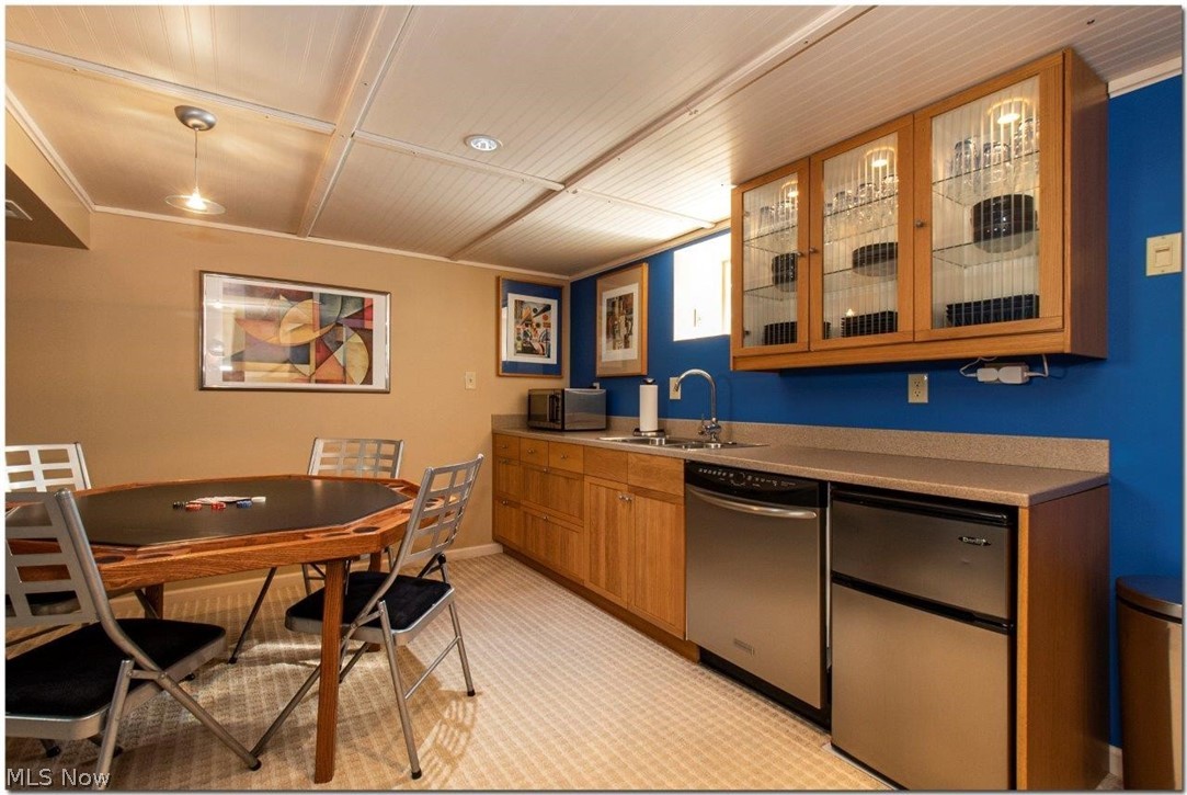 4660 Liberty Road South Euclid, OH 44121 - Photo 26 of 35 Fully Finished Lower Level Features a Spacious Media and Game Room with an Amazing Kitchenette, Perfect for Entertaining