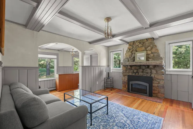 a room with a bed and a flat screen tv