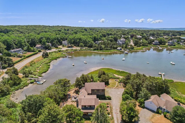 a view of a livingroom with furniture and a window