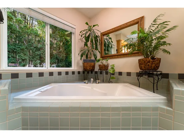 a bathroom with a toilet a sink and a mirror