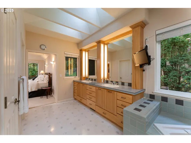 a kitchen with sink a stove and cabinets