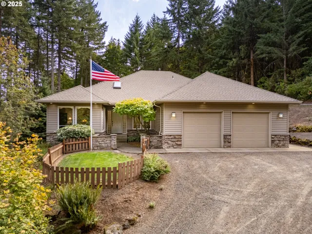 a front view of a house with garden and patio