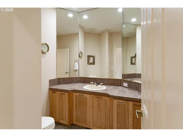 a bedroom with a bed and a chair