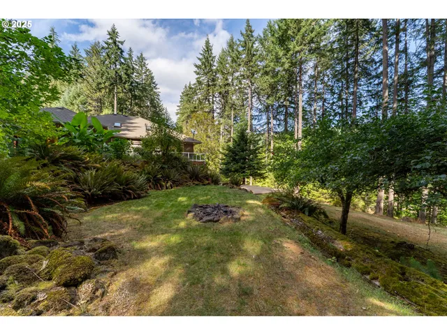 a backyard of a house with a yard and seating