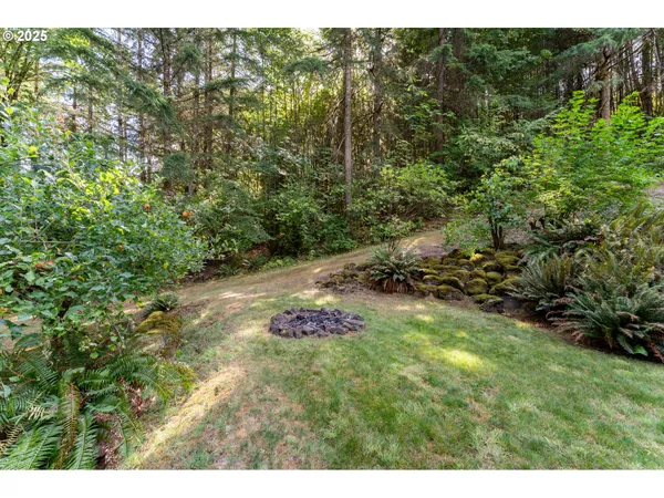 a backyard of a house with yard and outdoor seating