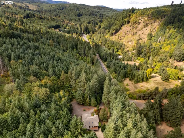 a view of a balcony next to a yard