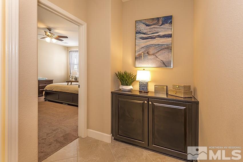 10171 Quintana Drive Reno, NV 89521 - Photo 21 of 25 a en suite bathroom with a sink and a mirror