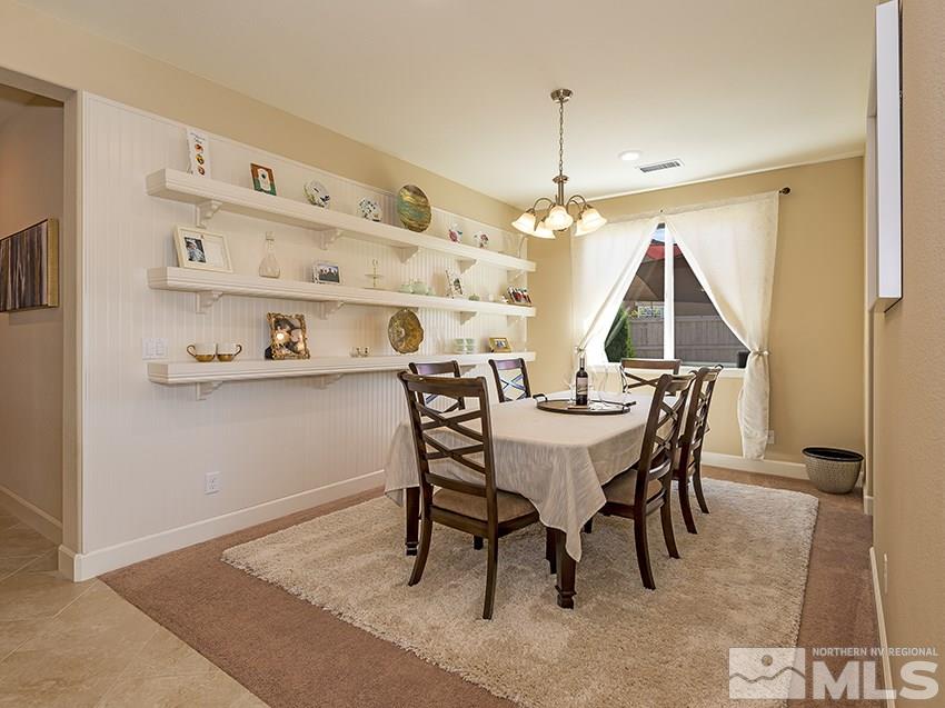 10171 Quintana Drive Reno, NV 89521 - Photo 7 of 25 a view of a dining room with furniture