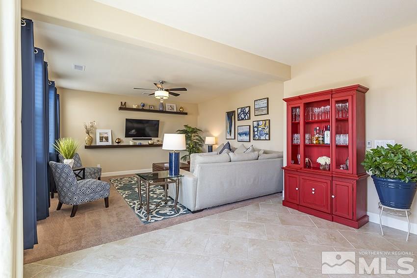 10171 Quintana Drive Reno, NV 89521 - Photo 10 of 25 a living room with furniture and flowers