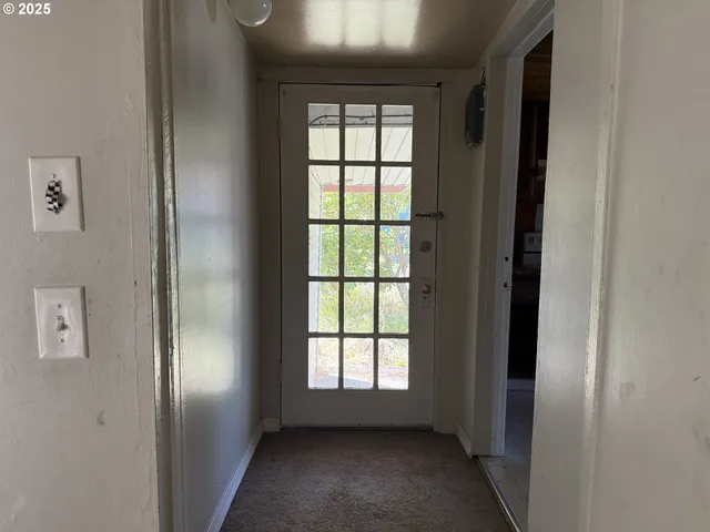 a view of empty room with windows