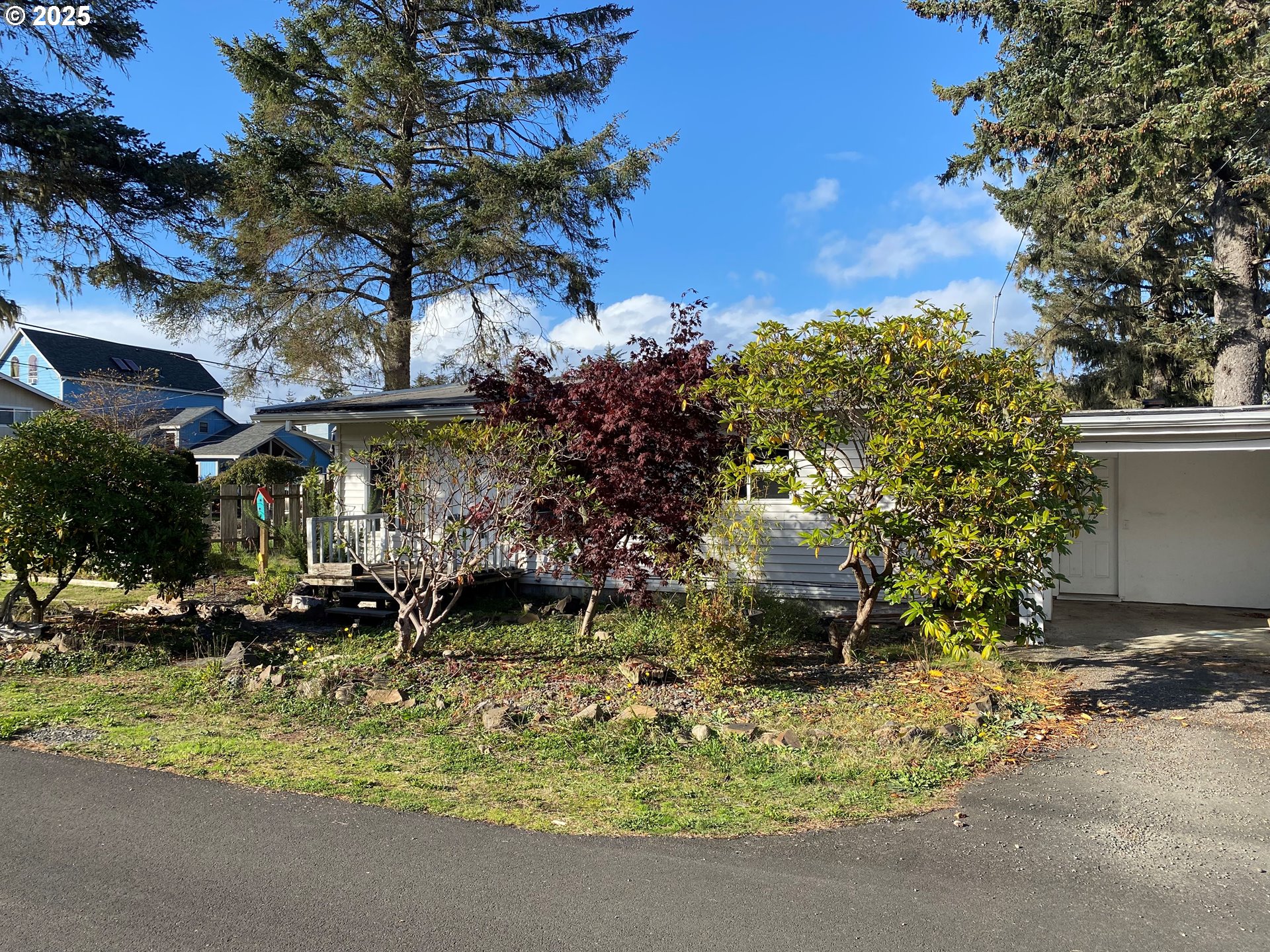 802 25th Avenue Seaside, OR 97138 - Photo 5 of 22 a backyard of a house with yard and outdoor seating