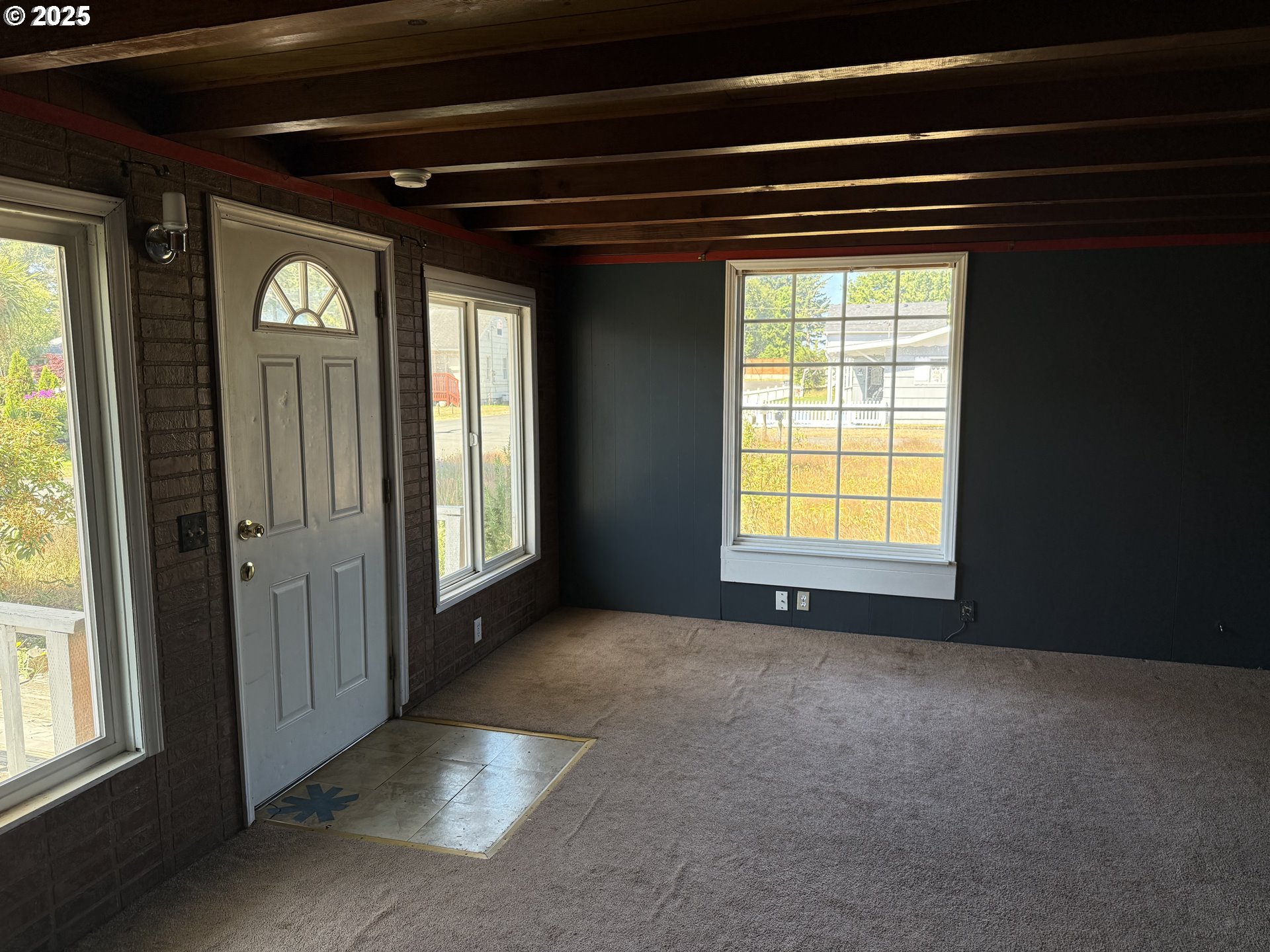 802 25th Avenue Seaside, OR 97138 - Photo 7 of 22 a view of an empty room with window and bathroom