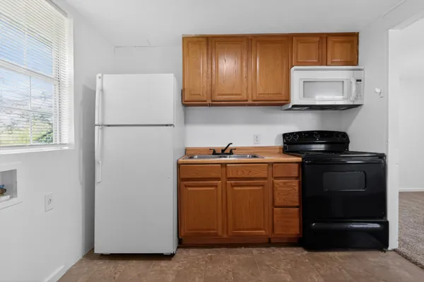 a view of a storage and utility room with washer and dryer