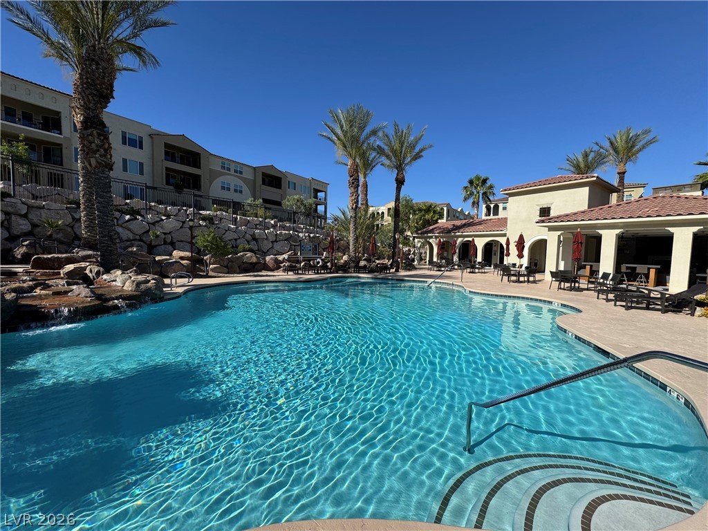 2555 Hampton Road, Unit 4205 Henderson, NV 89052 - Photo 49 of 52 This inviting outdoor pool area offers a refreshing oasis for relaxation and recreation.