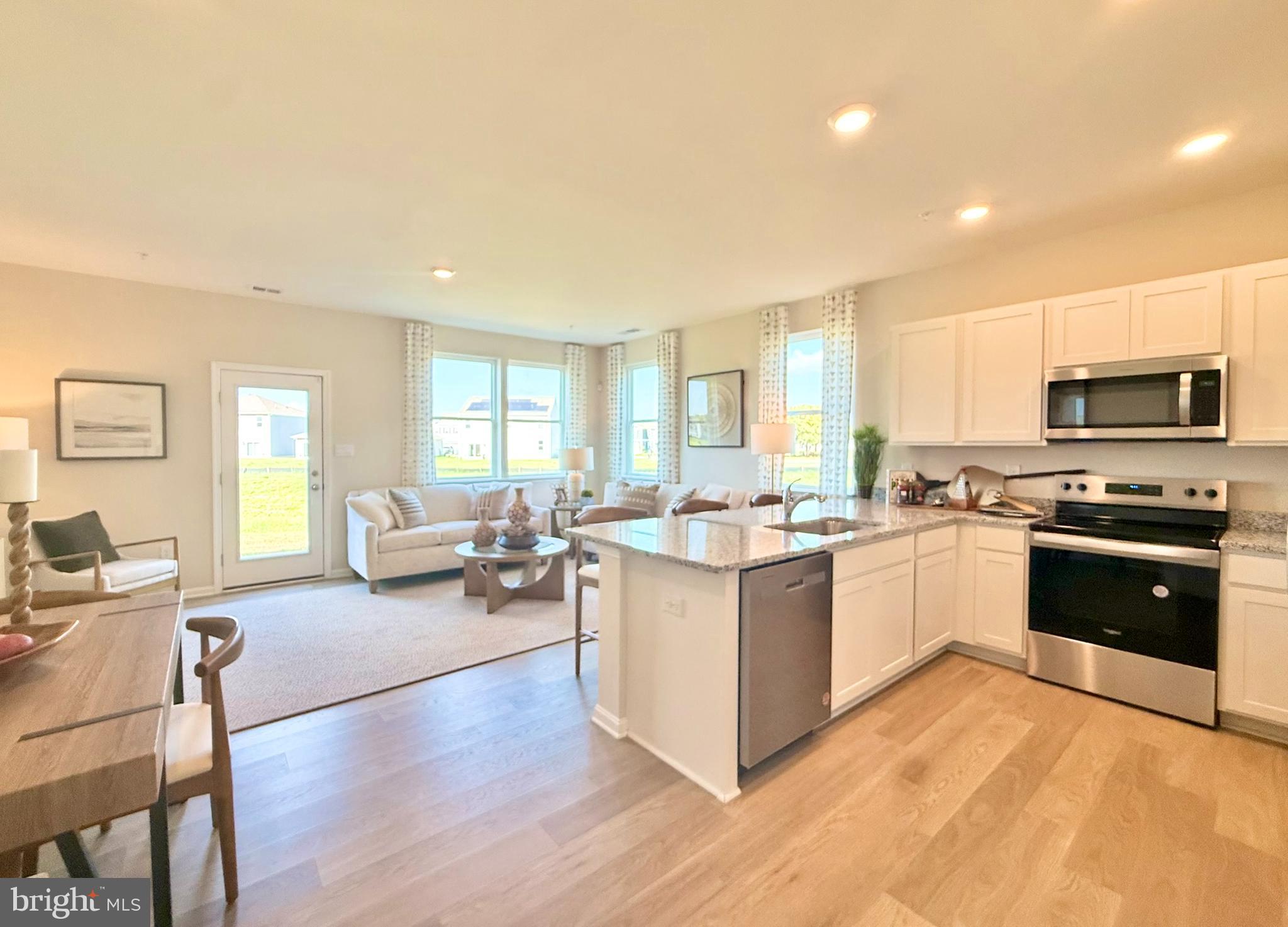 21473 Farmington Road Frankford, DE 19945 - Photo 12 of 30 a large kitchen with lots of counter top space a sink and appliances