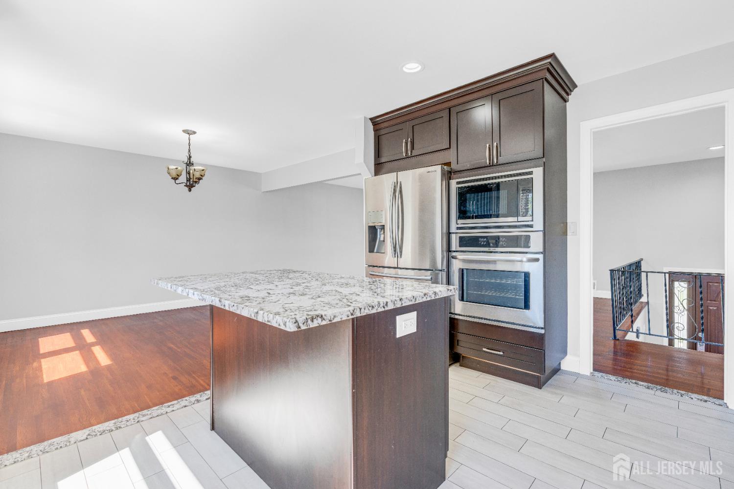 6 Marc Court Edison, NJ 08820 - Photo 11 of 42 a kitchen with kitchen island a counter top space and appliances