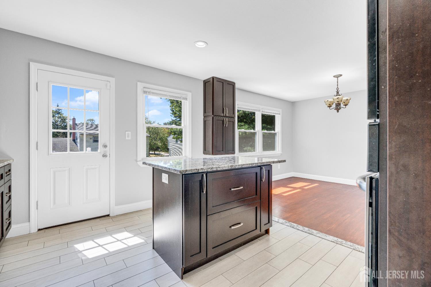 6 Marc Court Edison, NJ 08820 - Photo 12 of 42 an empty room with windows and cabinet